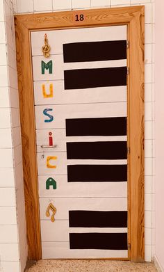 a door decorated with musical instruments and letters