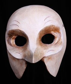 a white mask with two large eyes