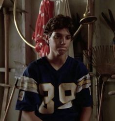 a young man in a football uniform sitting down