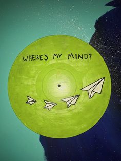 there's my mind? written on a green plate with paper airplanes flying around it