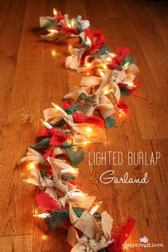 some lights that are laying on the floor in front of a wooden floor with a ribbon around it