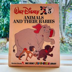 an old disney book with the title'animals and their babies'written on it