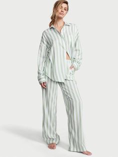 Crafted in an ultra-soft modal-cotton blend, these classic PJs are what dreams are made of. Oversized fit Long sleeve, button-front top hits at hips Chest pocket Pants with elastic waist Soft, plant-derived modal fibers, sourced from sustainably managed forests Machine wash Imported Long Pyjamas, Lingerie Catalog, Victoria Secret Pajamas, Pajamas Gift, Pajamas Sets, Cami Set, Striped Pyjamas, Victoria Secret Lingerie, Flare Leggings