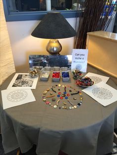 the table is covered with jewelry and cards