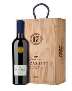 a bottle of wine in front of a wooden box