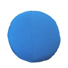 a blue round pillow on a white background