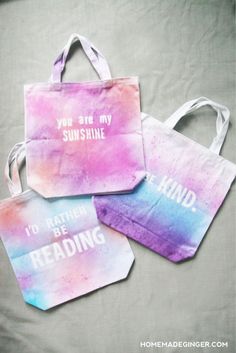 three bags with the words you are my sunshine and i'd rather be reading on them