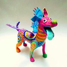 a brightly colored dog figurine on a white background