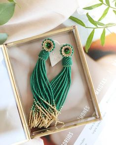 Dive into boho elegance with our dark green and gold beaded tassel earrings, featuring stunning seed bead fringe that sways effortlessly with your every move. These long dangle earrings are adorned with exquisite Swarovski crystal studs, adding a touch of sparkle to any outfit. Perfect as an elegant gift for her or a treat for yourself, these earrings are versatile enough for day or night. Elevate your accessory game and embrace your unique style with these captivating earrings. Shine bright! Th Boho Wedding Earrings, Gold Tassel Earrings, Seed Bead Jewelry Patterns, Beaded Tassel Earrings, Long Fringe, Earrings Bridesmaid, Earrings Beaded, Long Dangle Earrings, Earrings Long