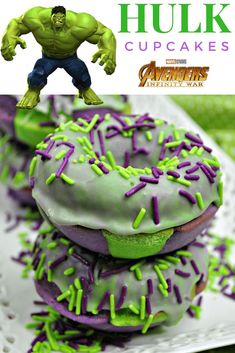 hulk cupcakes with green frosting and sprinkles are on a plate