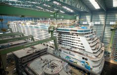 a large cruise ship being built in a building