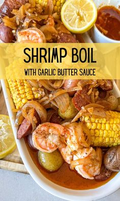 shrimp boil with garlic butter sauce and corn on the cob in a white bowl