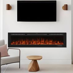 a living room with a television mounted on the wall and a fire place in front of it