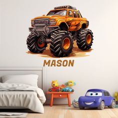 an orange monster truck with the name mason on it's back wall decal