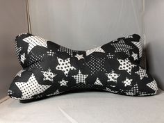 a black and white pillow with stars on it