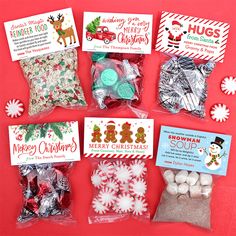 candy bags with christmas treats in them on a red background