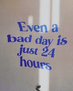 a sign that says even a bad day is just 24 hours