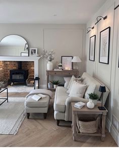 a living room filled with furniture and a fire place