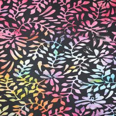 a black background with multicolored leaves on it