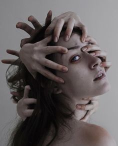 a woman with her hands on her head