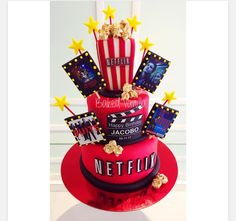 a red cake with movie themed decorations on top