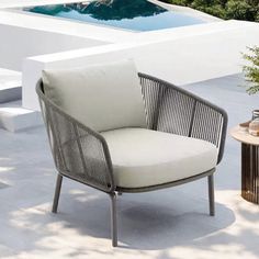 a chair sitting on top of a patio next to a pool