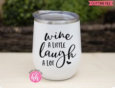 a white wine tumbler with the words wine a little laugh at it's bottom