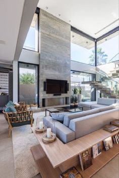 a living room with couches and tables in it