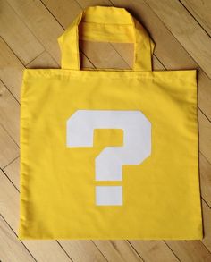 a yellow bag with a question mark on it