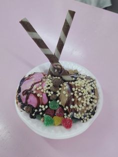 a white plate topped with lots of different types of candy and toppings on top of it