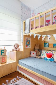 a child's bedroom with bunk beds and toys