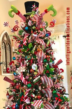 a christmas tree decorated with candy canes and ornaments