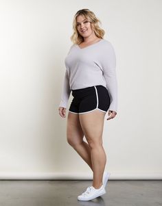 Be ready for anything with the Plus Size Hit The Ground Running Shorts. These super comfortable dolphin shorts have a contrast trim and elastic waistband. They're made from a smooth, stretchy knit material. These athletic shorts are made from 95% cotton and 5% spandex. Hand wash cold. Imported. Models are all wearing a size 1XL. Simple Sneakers, Half Pant, Demi Lovato Body, Dolphin Shorts, Curvy Shorts, Athletic Body, Early Spring Outfits, Shorts Womens