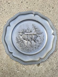 a metal plate with an image of a deer on it