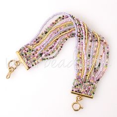 multicolored beaded lanyard with gold clasps and key chain on white background