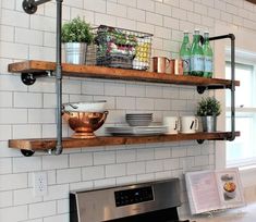 the shelves above the stove are filled with pots, pans and other kitchen items