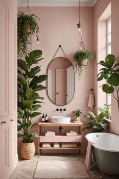 a bathroom with pink walls and plants in the bathtub next to the sink area