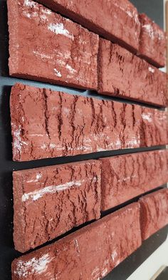 some red bricks are stacked on top of each other