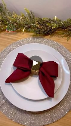 a white plate topped with a red bow