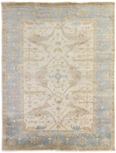 an antique rug with blue and beige colors