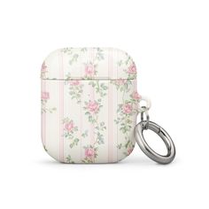 an apple airpods case with flowers and stripes on the front, and a keychain attached to it