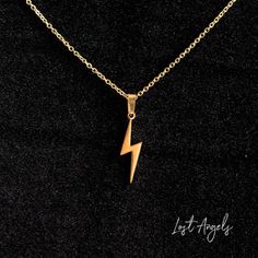 Lightning Bolt Necklace in Gold.   Also available in Rose Gold and Silver - Please check other listings. Material: Gold Plated Size: Pendant 2.5cm // Chain 46cm  Lobster Clasp Closure Comes with gift pouch Lightning Bolt Necklace, Anime Outfit, Leather Rivets, Gold Locket, Dainty Chain, Boho Pendant, Gift Pouch, Necklace Boho, Lovely Necklace