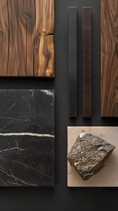 several different types of wood are displayed on a black surface with white and brown accents