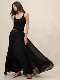 We opted for a luxurious pleated construction to showcase the beautiful drape of this chiffon maxi skirt.  A-line fit.  Invisible zip at wearer's left.  Fully lined.  A-line fit.  Maxi length.  Model: Size 2, 5'10" (178cm). Styling A Black Tulle Skirt, Black Chiffon Skirt, Metallic Pleated Skirt, Chiffon Maxi Skirt, Pleated Maxi Skirt, Chiffon Maxi, Formal Style, Dark Fashion, Bottom Clothes