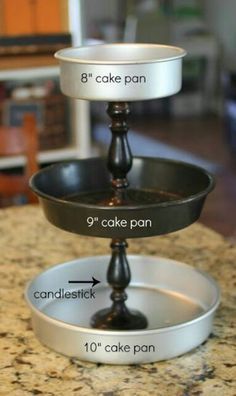 three tiered cake pans sitting on top of a granite countertop with measurements