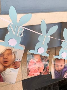 some pictures hanging on a clothes line with bunnies attached to them and two babies in bunny ears