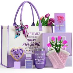 a purple bag with pink flowers in it next to some greeting cards and other items