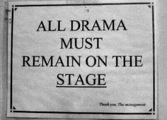 a sign on the side of a building that says, all drama must remain on the stage