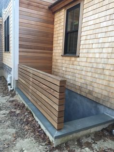 a house with wood siding on the side of it