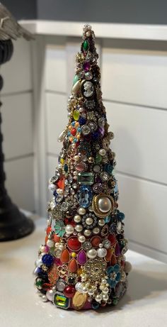 a small christmas tree made out of buttons